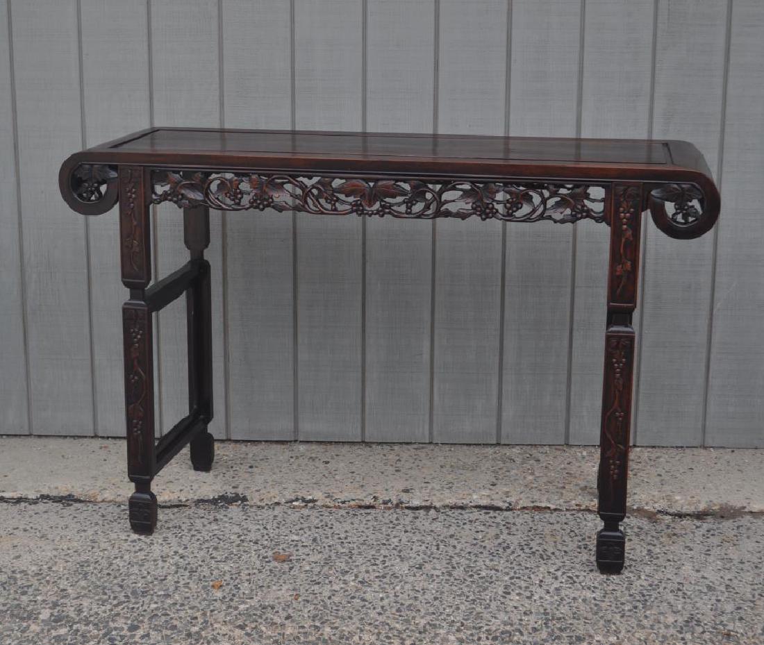 Chinese Carved Hardwood Altar Table: Chinese Carved Hardwood Altar Table with pierce carved grape and leaf pattern detail. Use wear, finish wear, loss, age cracks, scratches to top. 38 1/2" high, 58" wide, 18 3/4" deep. Provenance: Prope
