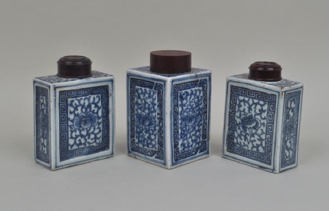 Three Chinese Blue & White Porcelain Tea Caddies: Three Chinese Blue & White Porcelain Tea Caddies with turned wood lids. Light soiling, smaller pair with old small edge chips, one with three hairline cracks to lower sides. Largest: 5 1/2" high, 3 1/