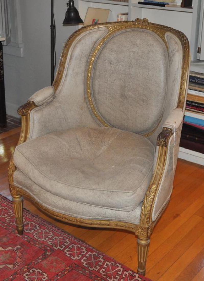 Louis XVI Style Carved Upholstered Bergere Chair: Louis XVI Style Carved Upholstered Bergere Chair with oval panel back, 39" high, 29" wide, 21" deep. Age and use wear. Provenance: Property of a Farmington, Connecticut Estate.