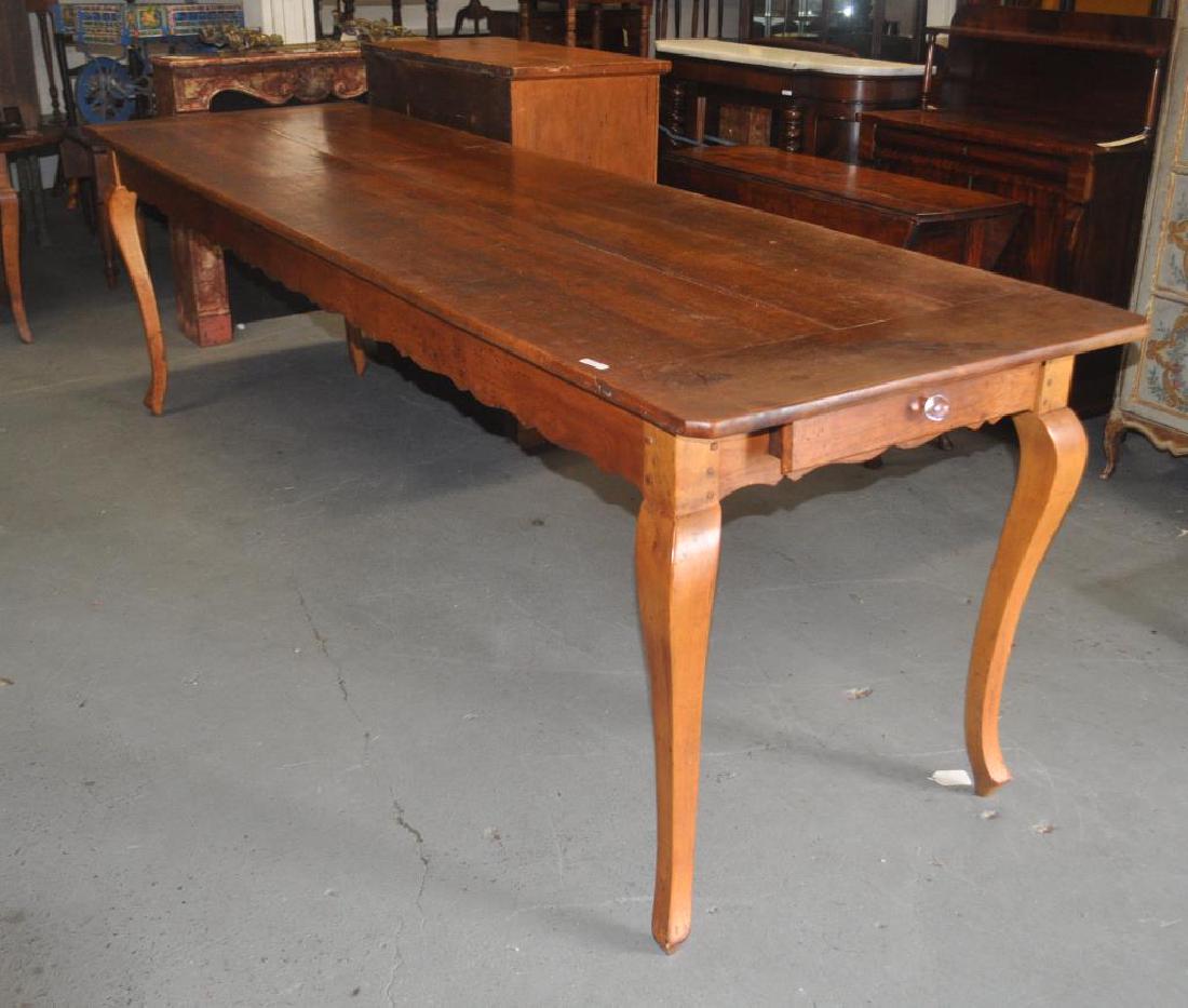 Long French Provincial Weaver's or Farm Table: Long French Provincial Weaver's or Farm Table 19th century, multiple board top, breadboard ends, scalloped apron, fitted with replaced elongated legs and together with the four original legs. 35" high