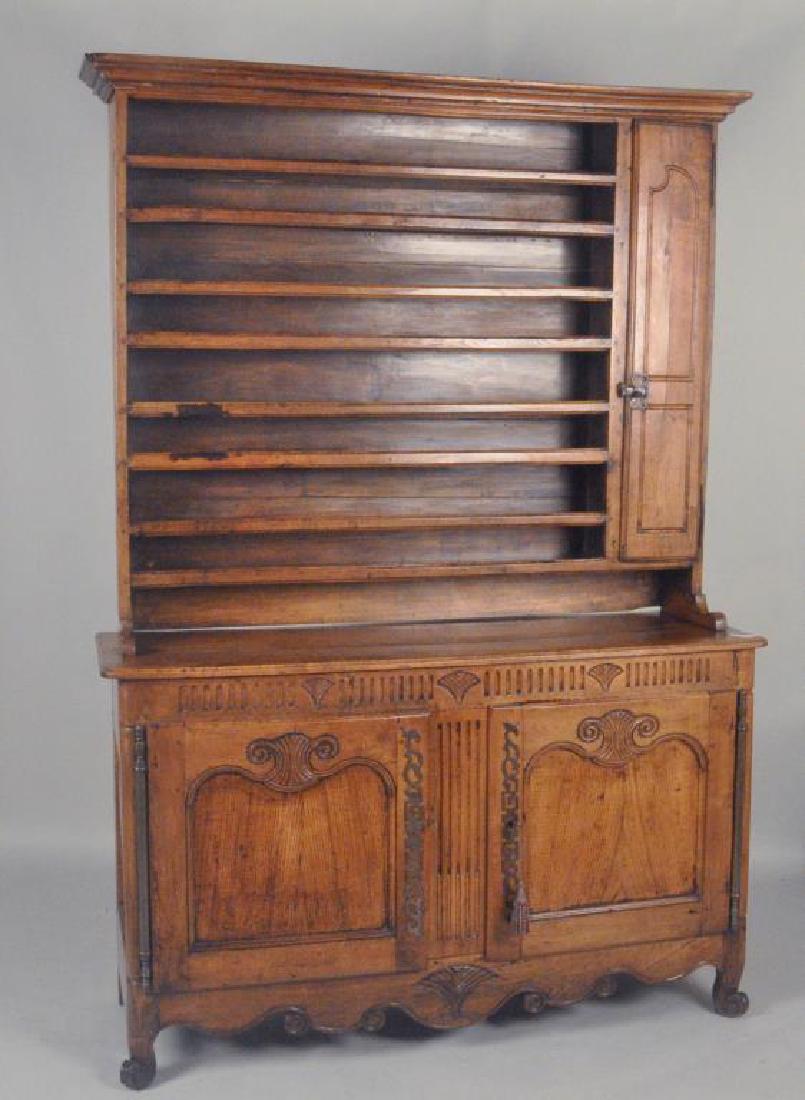 French Two Part Carved Chestnut Vaisselier: French Two Part Carved Chestnut Vaisselier having four open shelves and narrow cupboard door over two cupboard doors with key. Use wear, finish wear, loss, old small losses, stains. 90" high, 63" wide