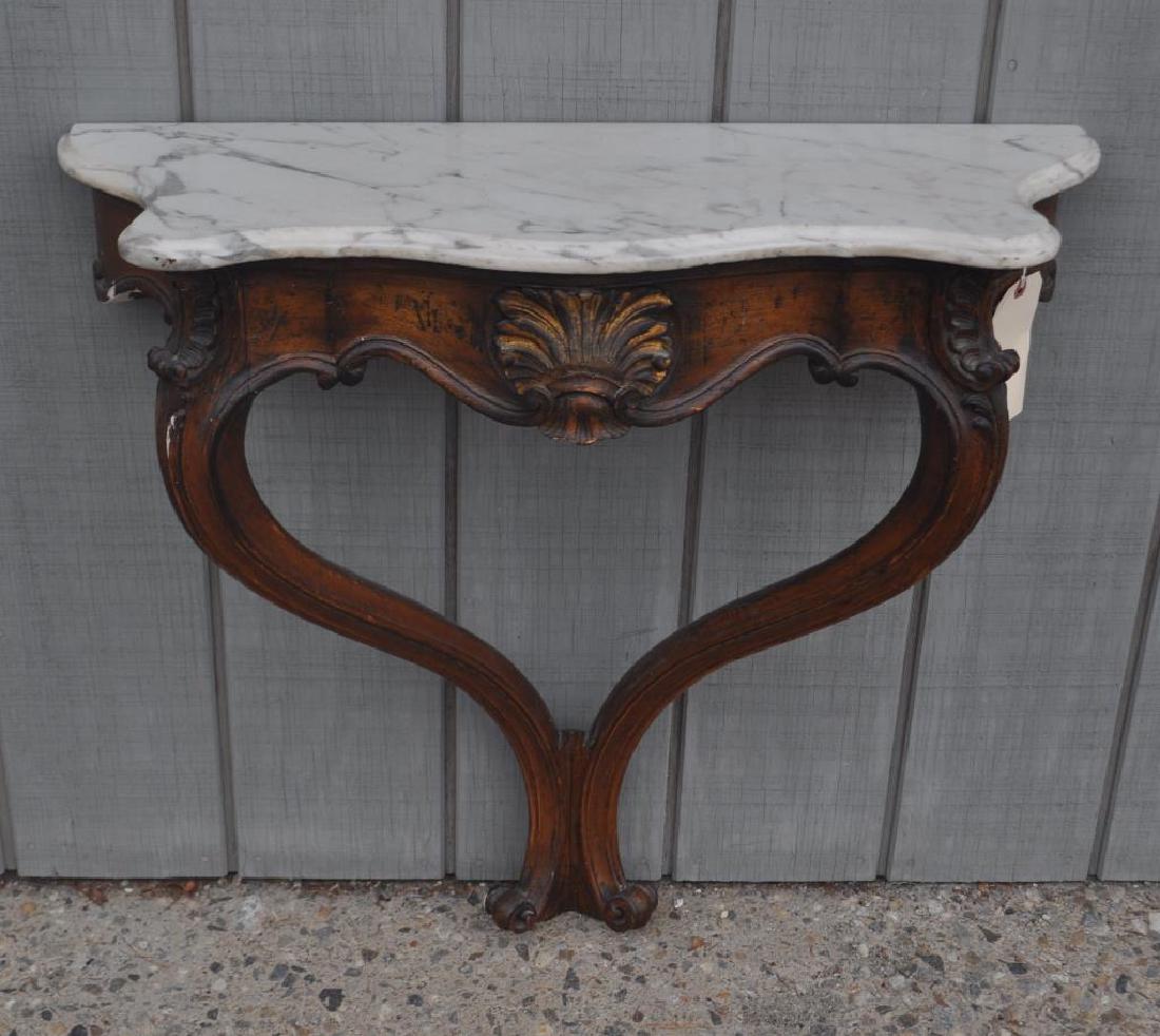Continental M/T Wall Mounted Carved Pier Table: Continental M/T Wall Mounted Carved Pier Table with shaped front edge and paint decoration, some age and use wear, chipping and losses. 30" high, 31" wide, 11" deep. Provenance: Property of a Farmingt