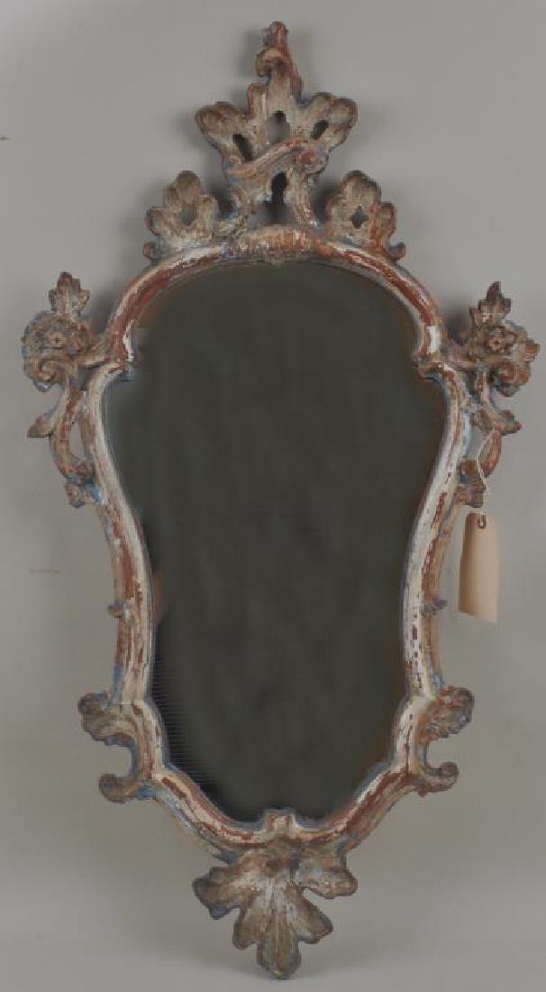 Continental Carved Polychrome Mirror: Continental Carved Polychrome Mirror of rococo design, some paint loss and flaking. 42" high, 23" wide. Provenance: Property of a Farmington, Connecticut Estate.