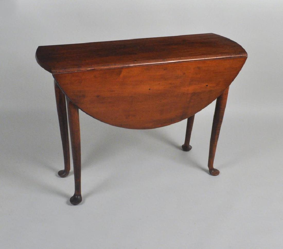 Queen Anne Oval Maple Drop Leaf Table: Queen Anne Oval Maple Drop Leaf Table with shaped apron. Finish wear, loss, age crack, marring to top. 28" high, 14 1/4" wide, 42" deep. Open: 40" wide. Provenance: Property of a Massachusetts Collect