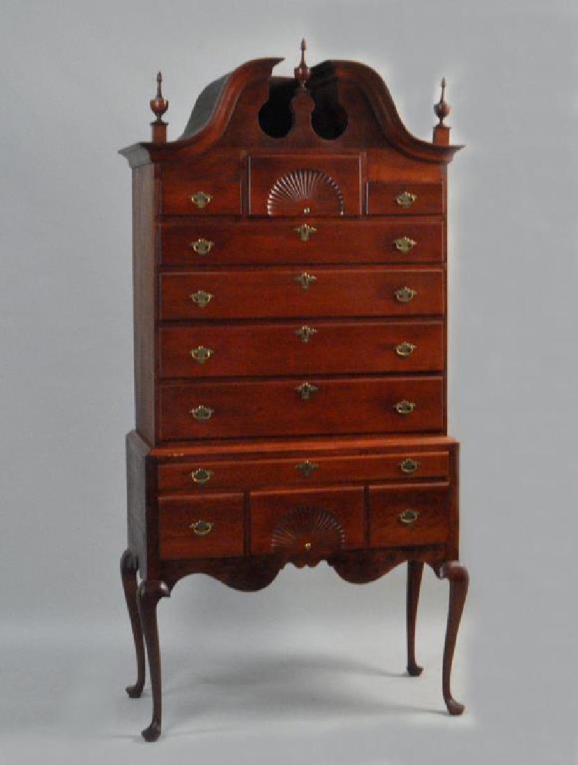 Connecticut QA Cherry Bonnet Top Highboy: Connecticut QA Cherry Bonnet Top Highboy having a broken arch top over fan carved central drawer flanked by two smaller drawers, four graduated drawers, base with one long drawer over central fan draw