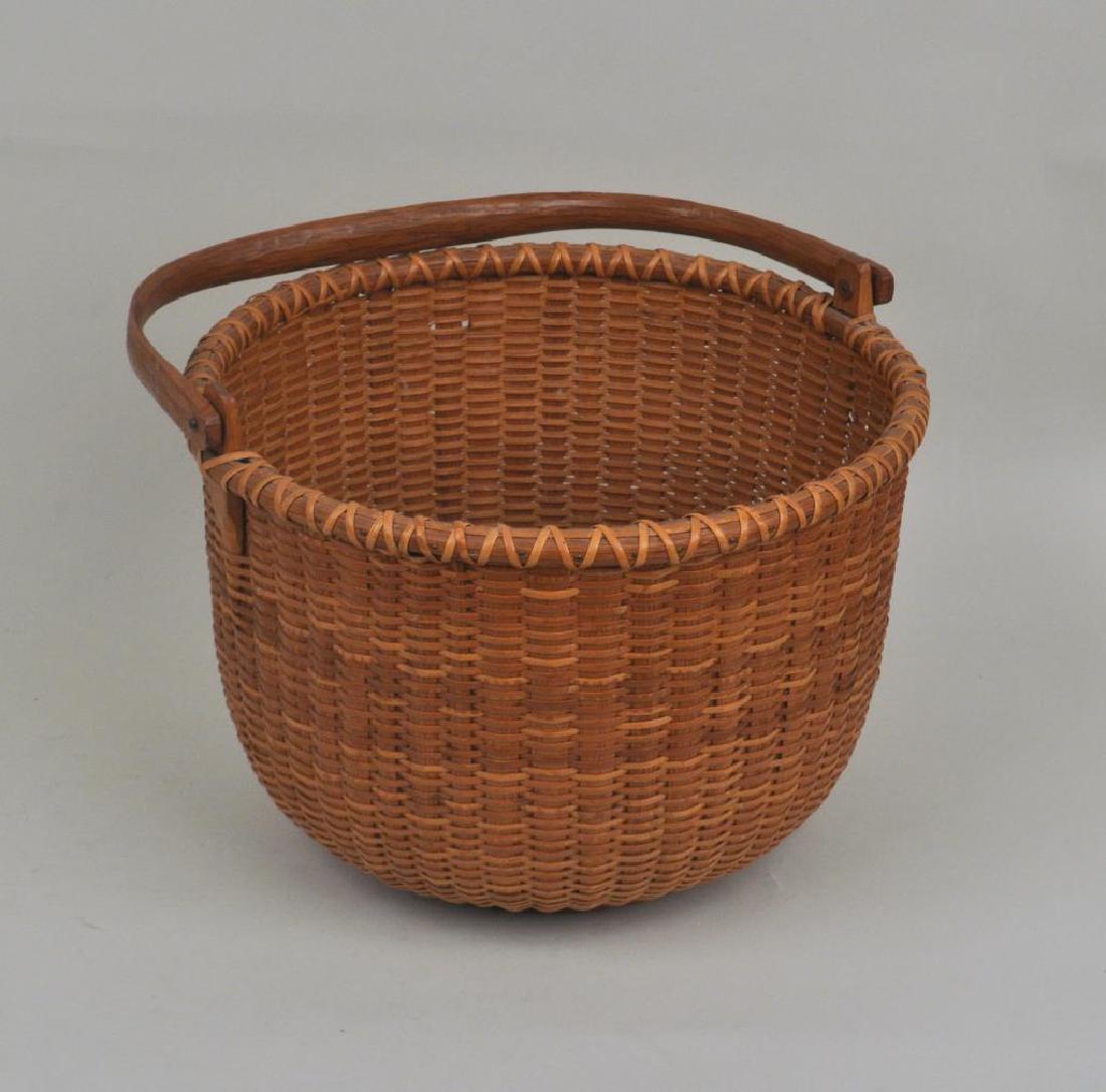 Jose Formoso Reyes Nantucket Lightship Basket: Jose Formoso Reyes Nantucket Lightship Basket (Philippine, 1902-1980), with decorative turnings on base interior signed, "Made in Nantucket." Use wear, light soiling, a few small breaks, losses, base 