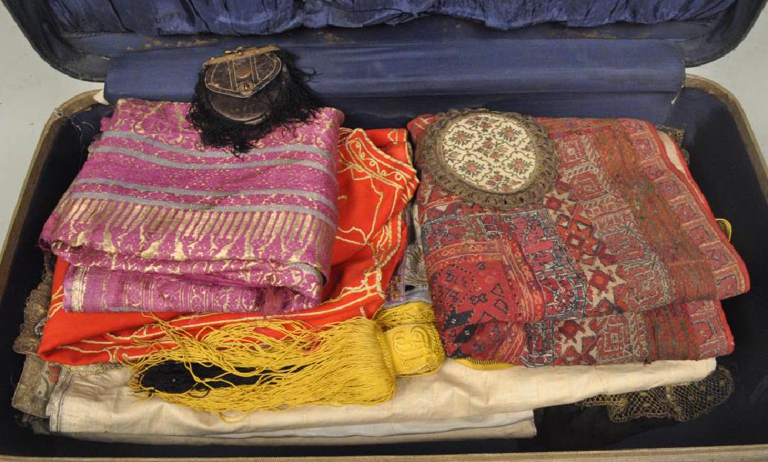 Group Victorian Fabric, Ethnic Clothing: including a Soumak embroidered panel, a silk sari, an embroidered jacket, two taffeta table runners and other items. Wear, tears, stains, losses, holes to some, sari with tears, repairs, fragile areas