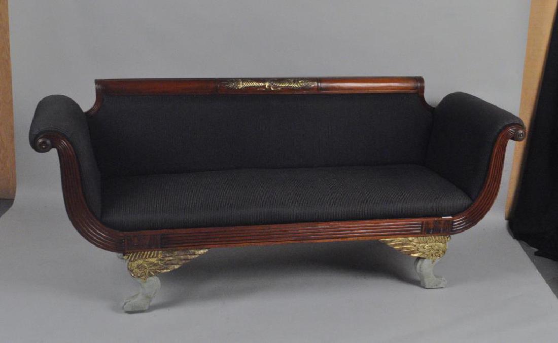 NY Classical Carved, Gilt & Painted Sofa: likely from the workshop of Duncan Phyfe, with cornucopia carved crest and scrolled arms, reeded front rail with winged paw feet, with some restorations and added gilt highlights. 33" high, 81" wide,