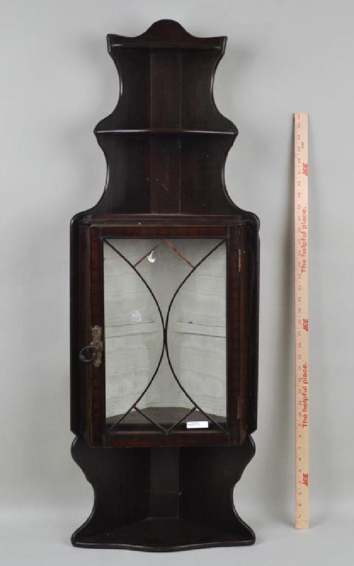 George III Style Hanging Corner Shelf/Cabinet: with mullioned glass doors. Finish loss to lower shelf. 44" high, 15 1/4" wide, 1 1/2" deep.