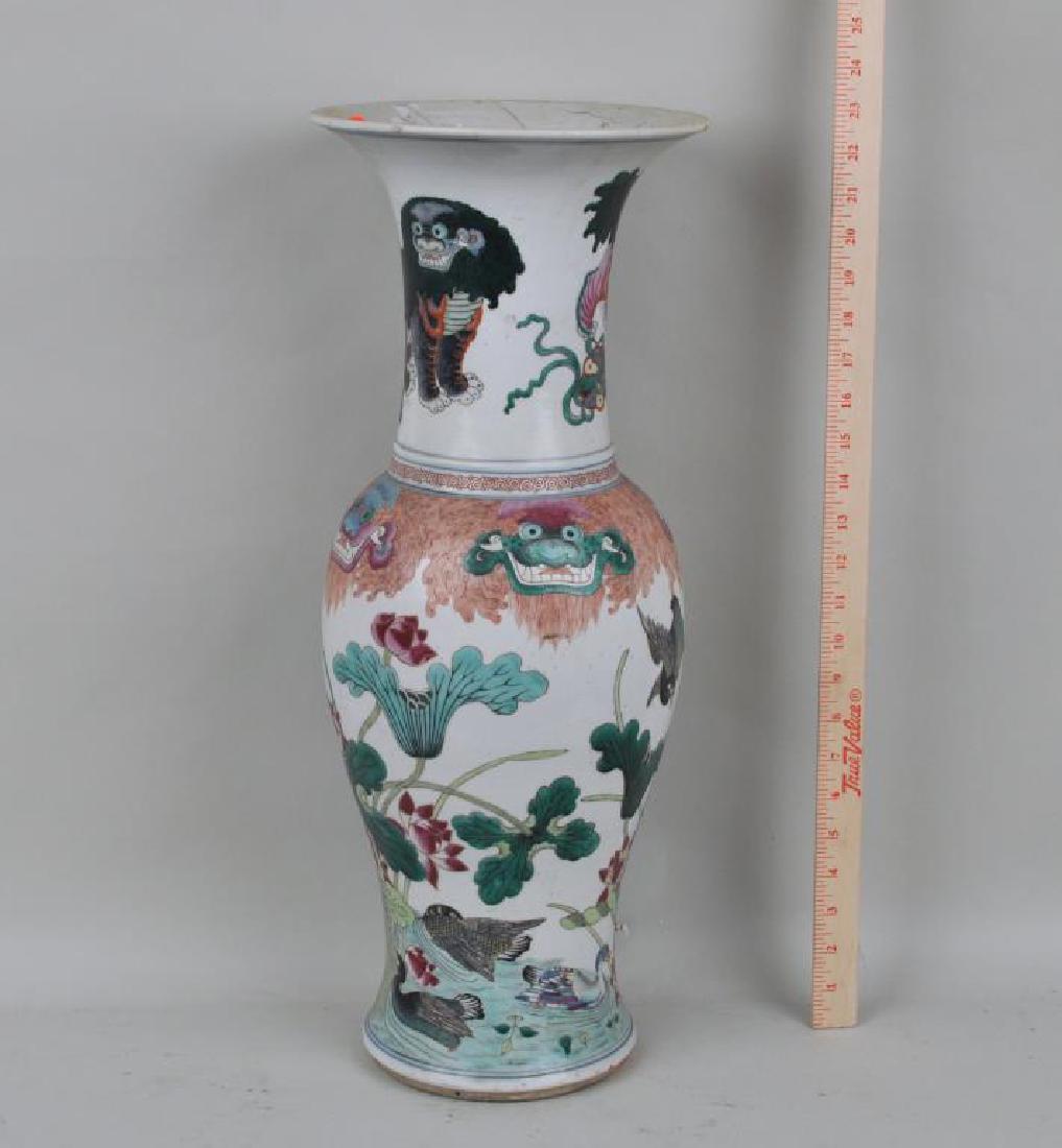 Large Chinese Porcelain Vase: baluster form with foo dogs, lotus and ducks. Old repairs to flared rim. 23" high, 9" wide. Provenance: Property of a CT Estate.