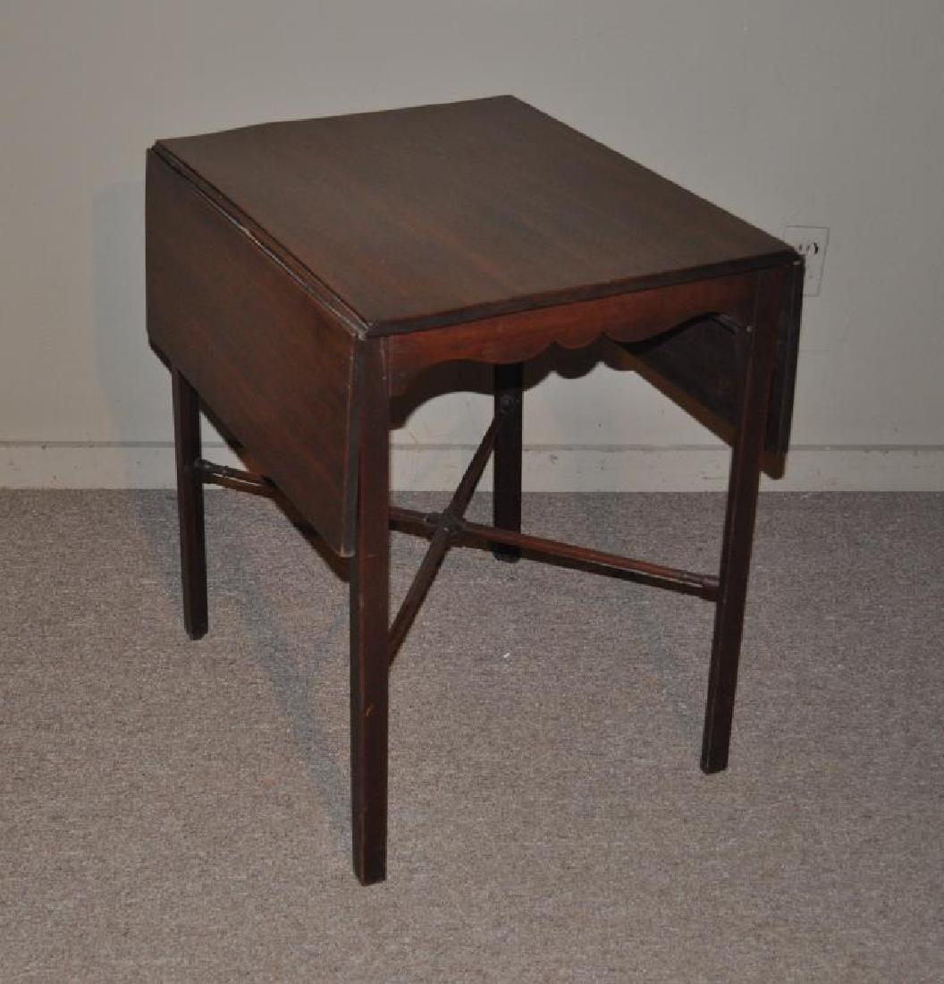George III Mahogany Pembroke Table: with shaped apron, X-form stretcher. Stains, marring to top, loose joints. 28" high, 20 3/4" wide, 24 3/4" deep, 39 3/4" wide open. Provenance: Property of a NJ Private Collector.