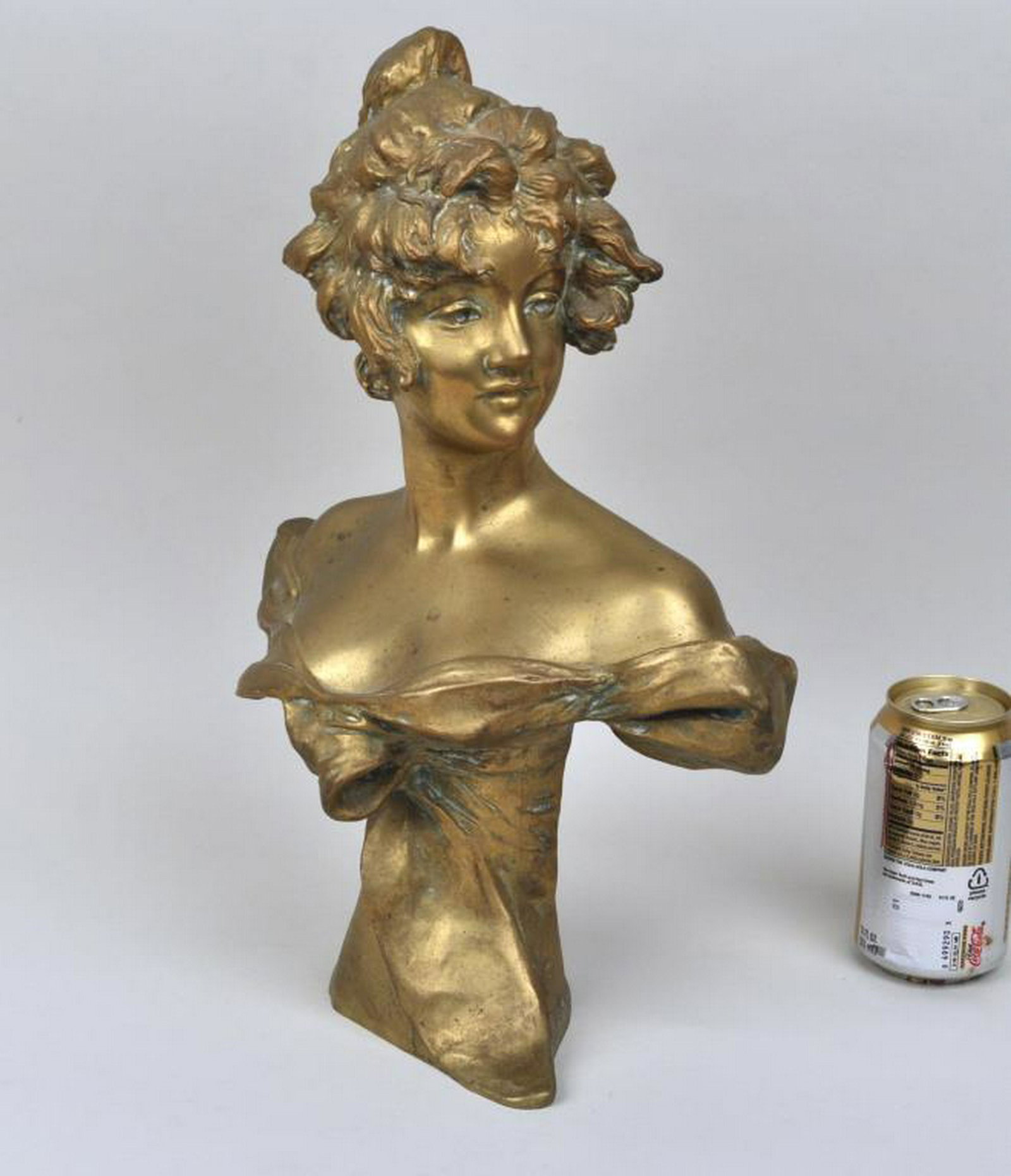 G. van der Straeten, Bronze Bust of a Young Woman: Georges van der Straeten (Belgian 1856-1928), signed verso with foundry mark for Societe des Bronzes de Paris. Stamped Made in France and numbered J.P. 9796. 16" high. Showing some wear, oxidation. Pr