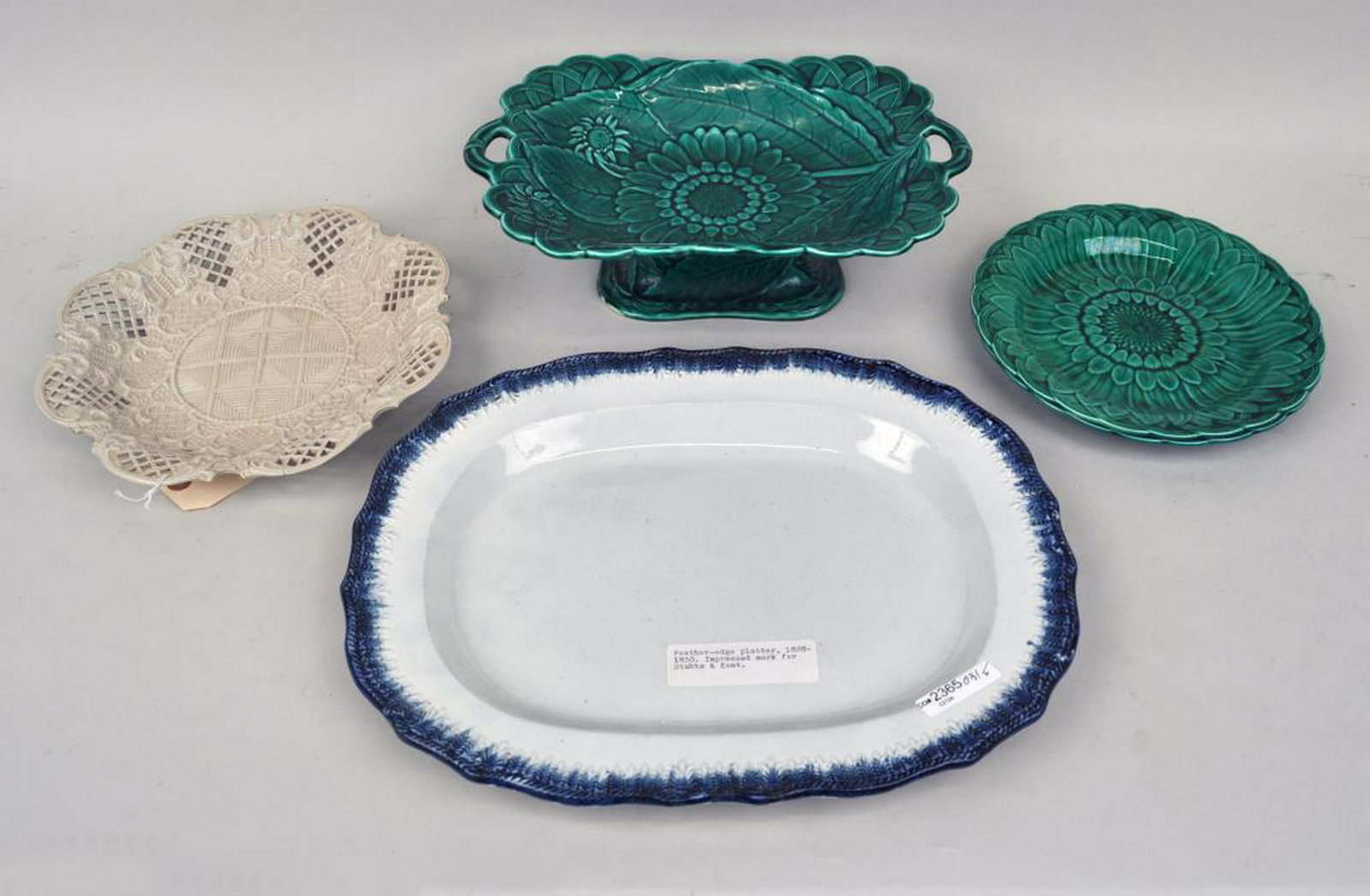 Estate Group English Porcelain/Pottery Wares: comprising a Wedgewood majolica green glaze sunflower rectangular footed compote and two plates; a pierced, reticulated creamware plate; and a Leeds blue feather edge platter marked for Stubbs & Kent.