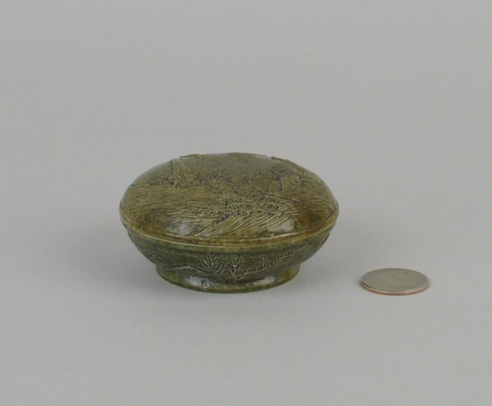 Chinese Lidded Porcelain Brush Washer: circular form with relief landscape decoration. Wang Bingrong seal mark to underside. 1 1/2" high, 3 1/8" diameter. Enamel wear, loss to interior lid, two tiny rim chips to base, seal past residue in 
