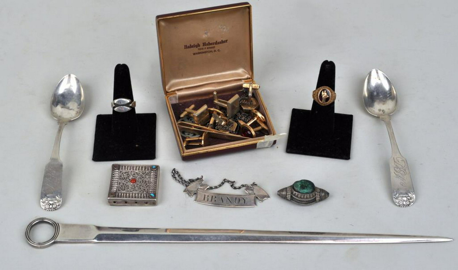 Estate Lot Gold Jewelry, Silver & Sheffield Items: comprising a sterling "Brandy" decanter tag; two American coin silver teaspoons marked "Bellows"; a London sterling letter opener marked "WE.WF.WC"; a sterling ring; a 10K gold class ring; a turquoise