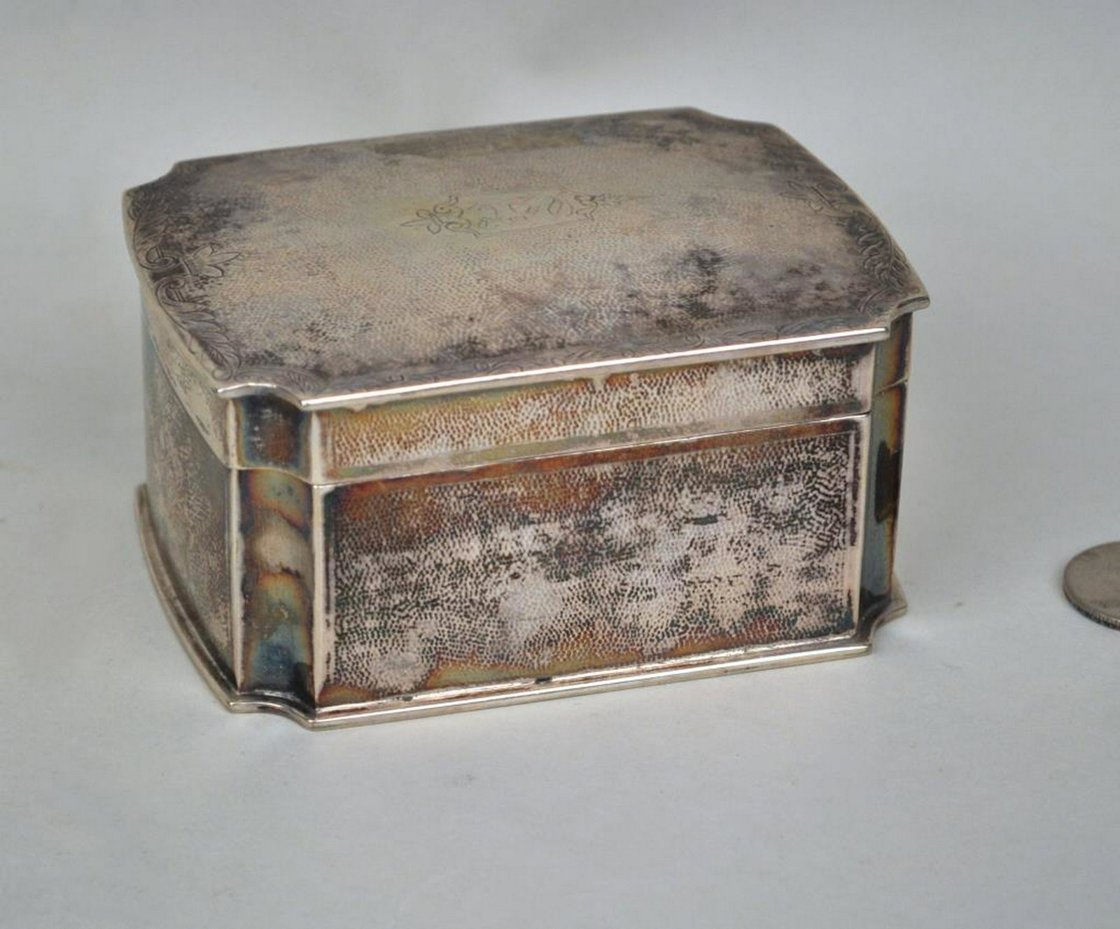 Hallmarked Chinese Silver Lidded Dresser Box: monogrammed. 2" high, 4" wide. Interior and base scratches. Weight: 6.695 OZT.