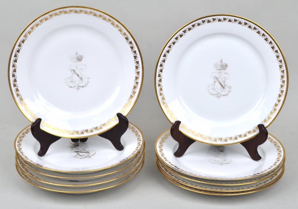 Set Ten French Porcelain Plates "Napoleon III": with gilded Napoleon III crest and ivy leaf rim. In the King Louis Philippe I period style. With various Sevres dates, and foundry marks ranging from 1835 to 1852. 9 1/2" diameter. Gilt loss to crest,