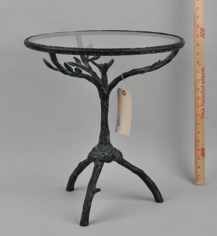 Giacometti Style Metal Twig Occasional Table: naturalistic tree form, with tripod base and inset glass top. 18" high, 16" diameter. Oxidation, repair to support.