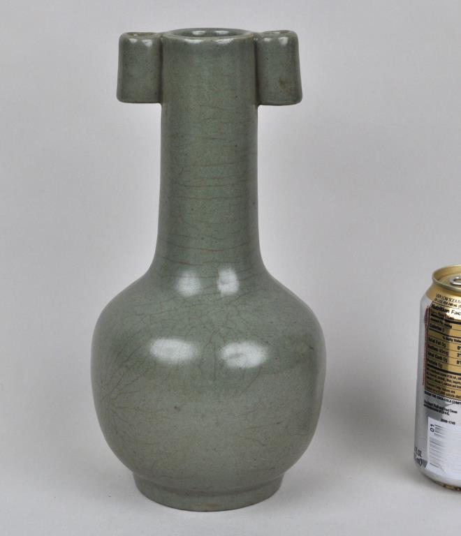 Chinese Porcelain Celadon Glazed Bottle Vase: mallet form with carrying lugs to the neck, probably Qing dynasty. 10 1/2" high, 5" diameter.