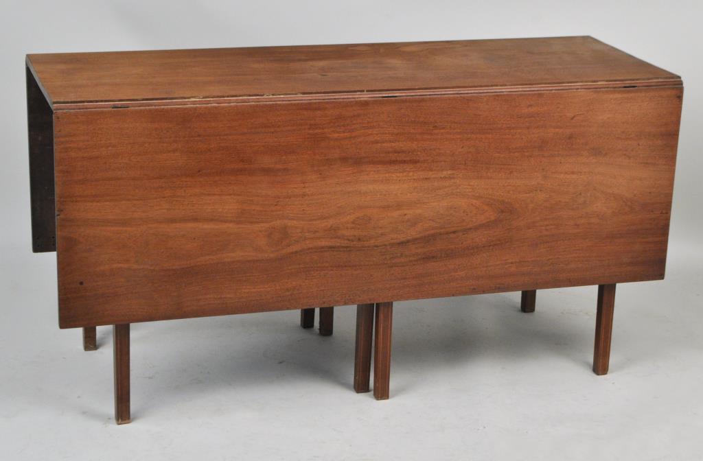 Massachusetts Hepplewhite Inlaid Dining Table: with drop leaves and swinging interior legs. 28" high, 18 1/2" (closed) 54" (open) wide, 54" deep. Estate condition, sun fading.
