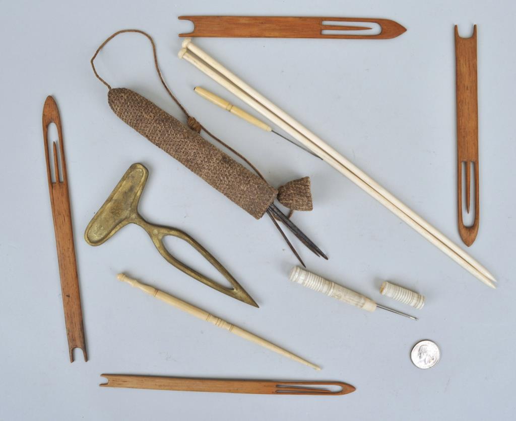 Group Sailor Made Sailmaking/Sewing Items: comprising a macrame needle case with four tools, a needle case with needle, three sewing tools, four wood weaving tools and a brass seam rubber. Largest: 12" long, 1/4" wide. Use wear, soiling; age c