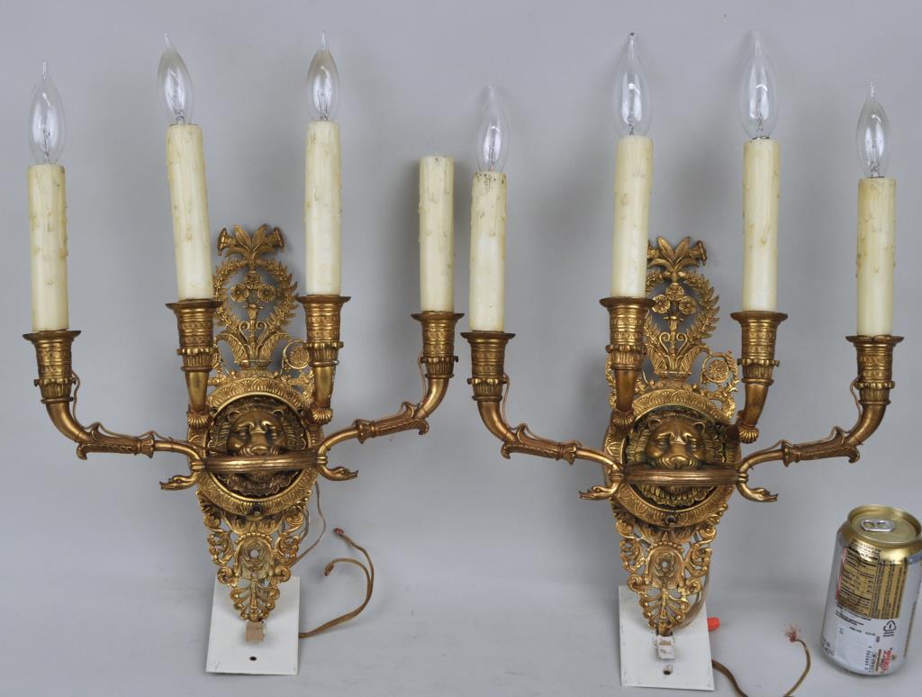 Pair Gilt Bronze Four Branch Sconces: with lion's head and openwork floral decoration, probably French. 13" high, 13" wide, 4" deep. Scuff to one arm.