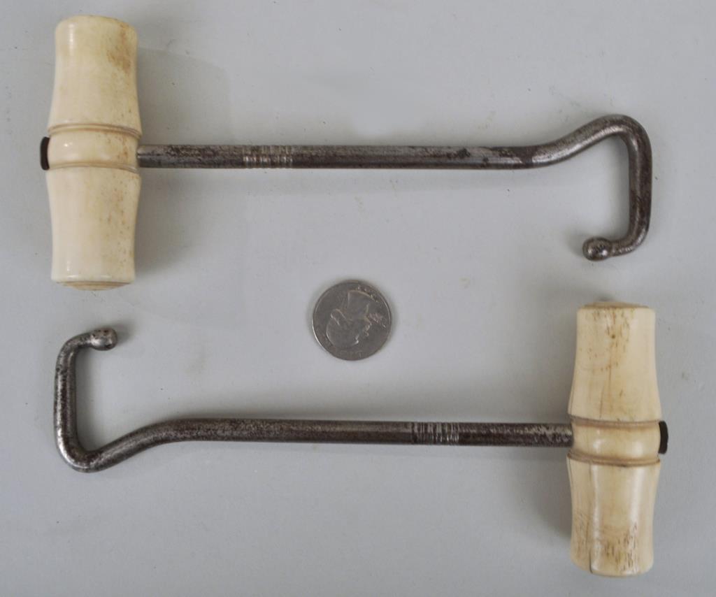 Pair Whalebone & Iron Boot Pulls: with turned handles. 7" long, 3" wide. Handles with age cracks, a couple small losses, rust. Provenance: Property of a New Haven County CT Estate.