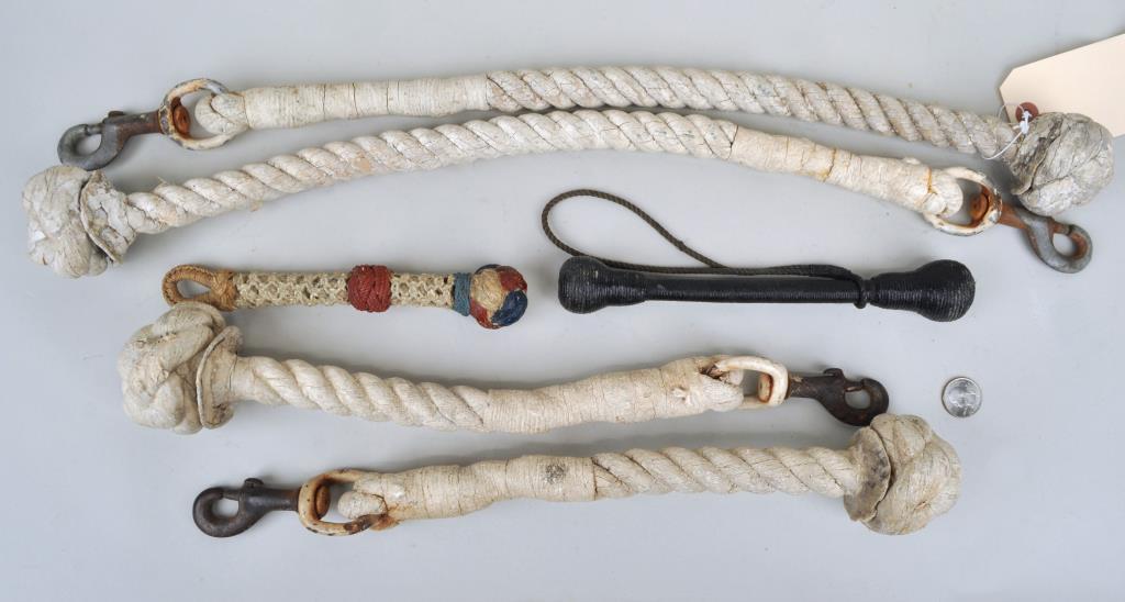 Six Sailors' Macrame Tools: including a sailor's priest wrapped in twine and five monkey fist line throwing clubs. Largest: 24" long, 2 1/2" wide. Use wear, soiling, paint wear, loss. Provenance: Property of a New Haven County C