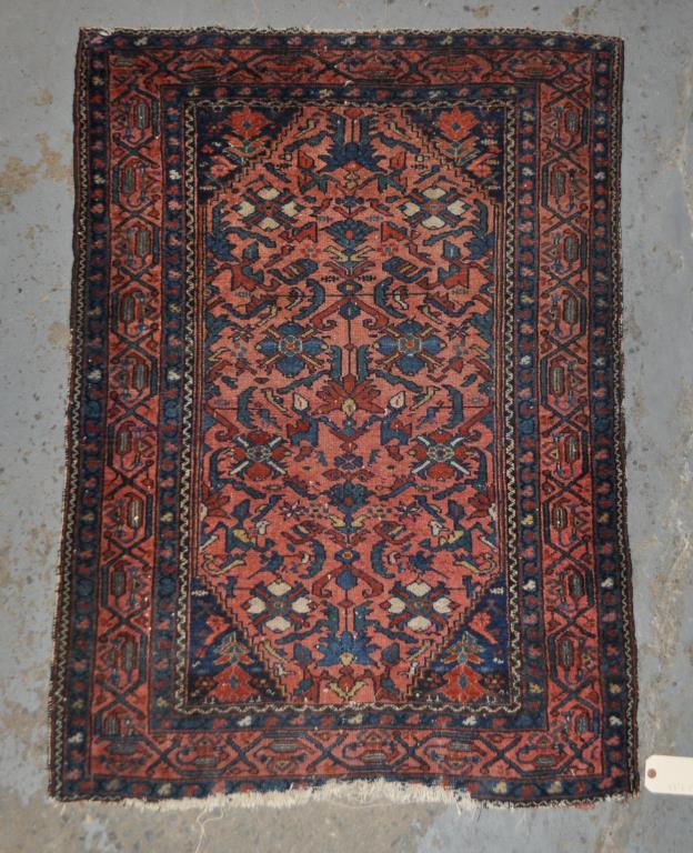 Persian Area Rug: 4' 5" long, 3' 3" wide. Fading, slight edge loss. All rugs sold as is.