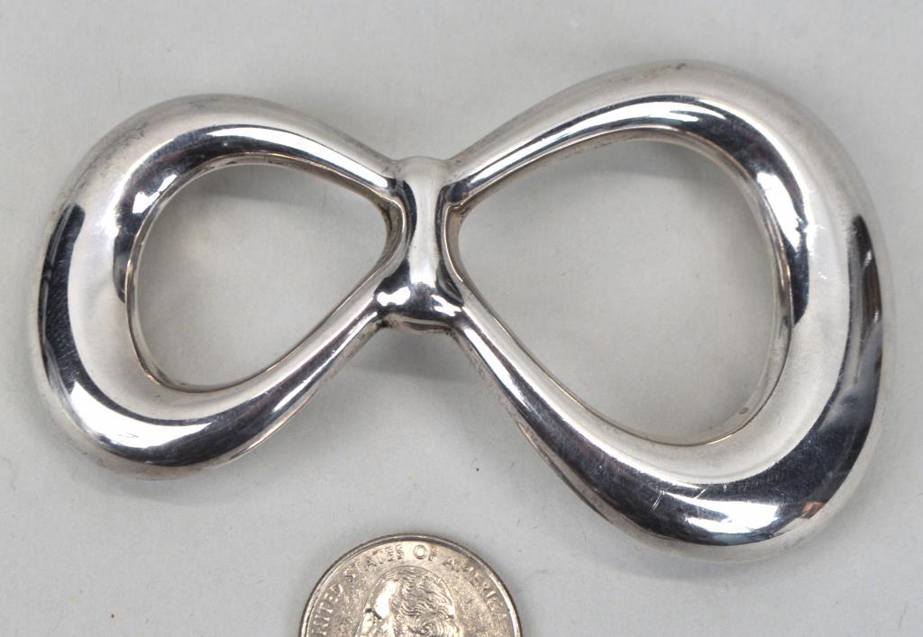 Tiffany & Co. Sterling Elsa Peretti Belt Buckle: 2 1/8" wide, 3 3/4" long. Weight: 1.2 OZT. *No credit card payments will be accepted for silver, gold, or jewelry from buyers that have not purchased from our gallery in the past.