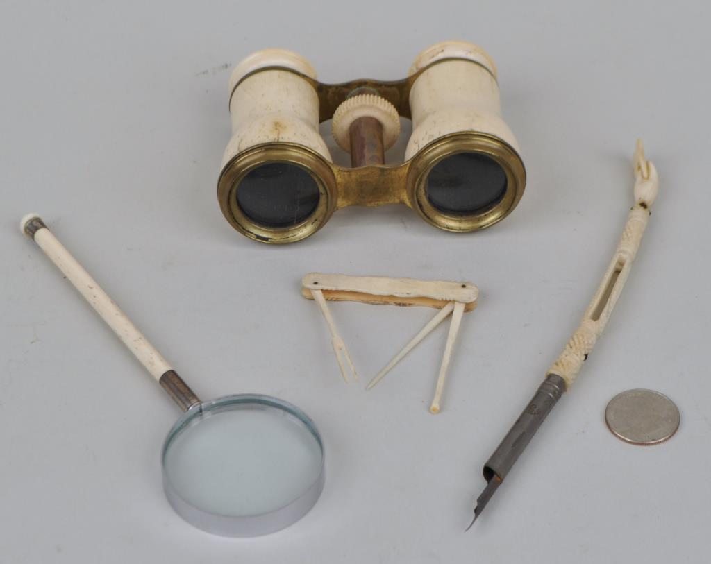 Bone Opera Glasses/Desk Items: including folk carved fountain pen and magnifying glass. Largest: 7 1/2" long. Cracks to opera glasses. Provenance: Property of a New Haven County CT Estate.