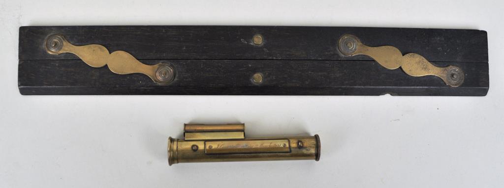 Cased F. Casartelli Brass Scope w/Level: made in Manchester, together with a cartographer's tool. Largest: 15" high, 2 1/4" wide. Use wear, wear, losses to case, edge chip to tool. Provenance: Property of a New Haven County CT Estate.