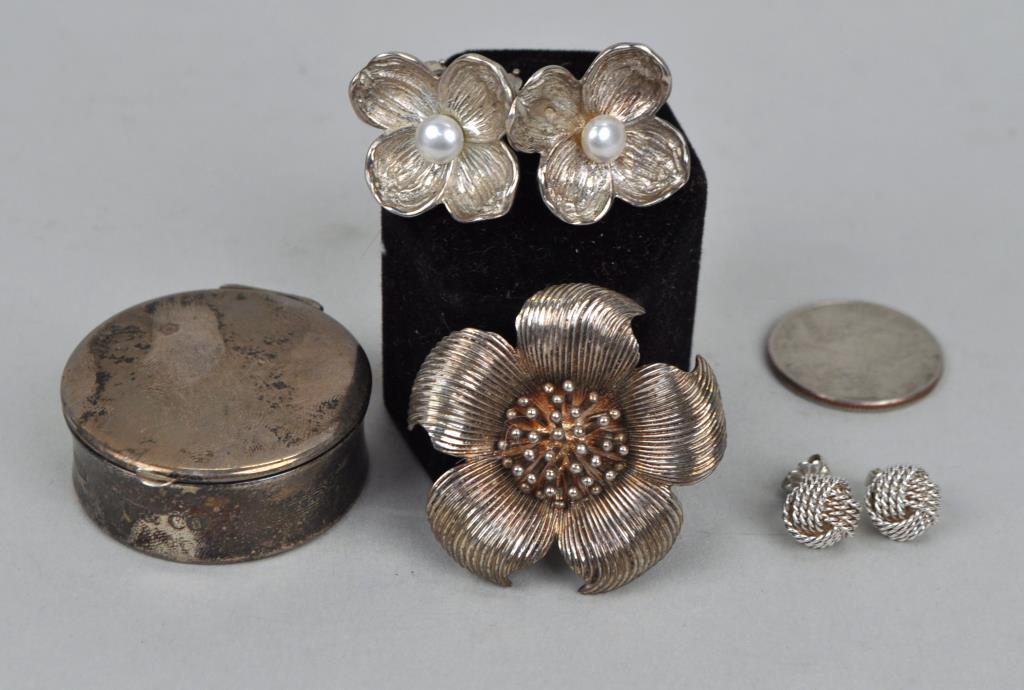 Three Pieces Tiffany & Co. Sterling Jewelry: comprising a pin, two pair of earrings, one with pearls, and a pill box. Largest: 2" diameter. Use wear. Gross weight: 1.765 OZT. *No credit card payments will be accepted for silver, gold, or jewelry