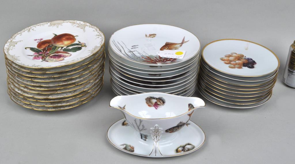Partial Rosenthal Fish Service, Haviland: comprising 12 Rosenthal plates and a gravy boat, 11 Haviland and 9 Bavarian plates. Largest: 9 1/2" diameter. Gilt wear, slight enamel wear, Gilt wear, slight enamel wear, small edge chip to one Rosen