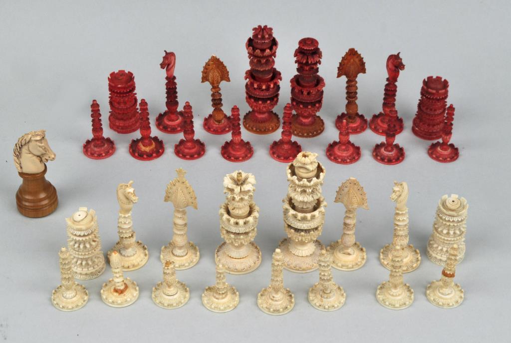 Carved Indian Chess Set: Largest: 4 1/4" high, 1 1/2" diameter. Chips, cracks, losses. International clients may be ineligible to bid on this item which may contain material not permitted to be shipped outside of the USA or t