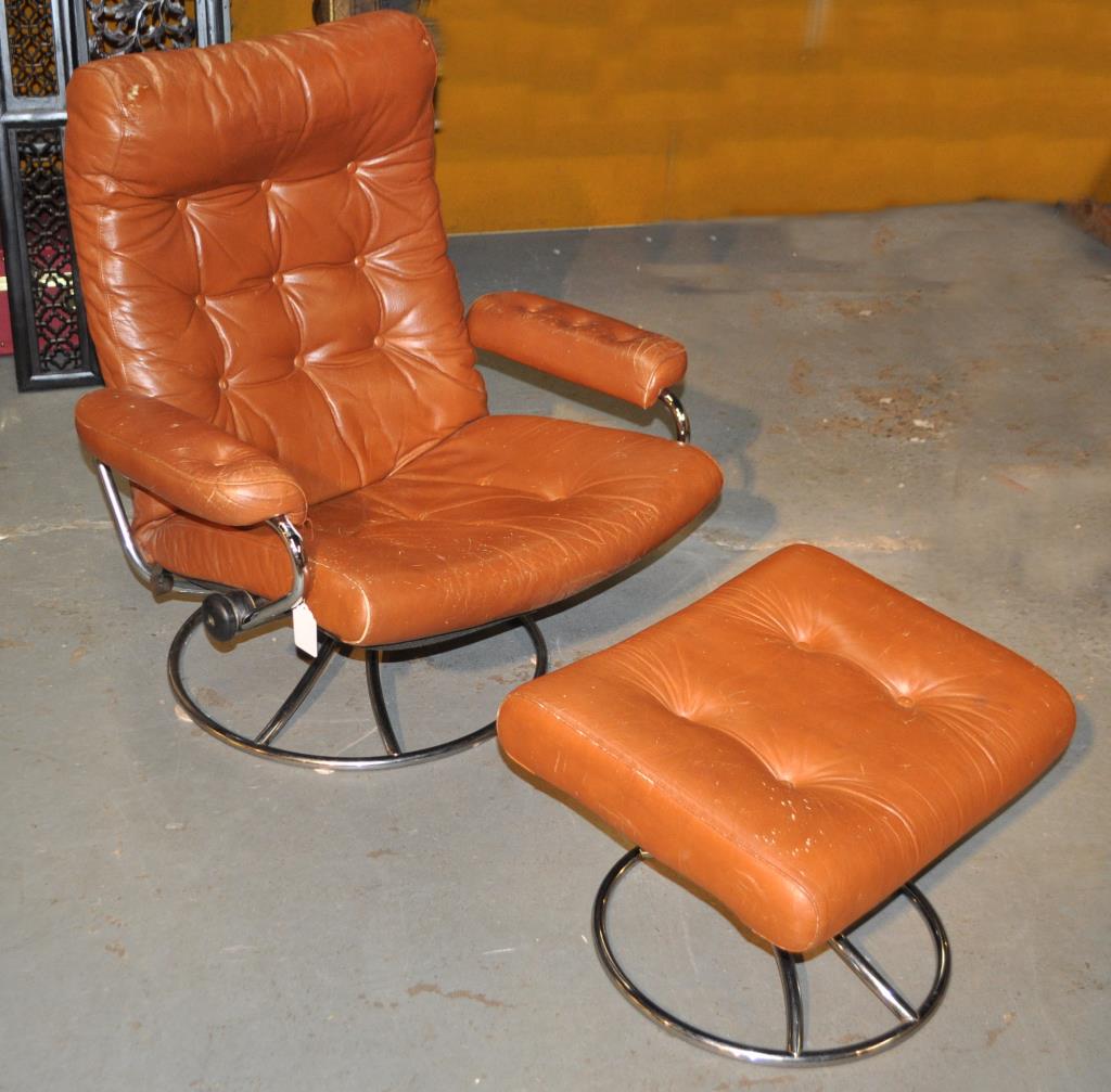 MCM Modern Swivel Reclining Easy Chair/Ottoman: upholstered in brown vinyl. Chair: 37" high, 33" wide, 24" deep. Ottoman: 15 1/2" high, 21 1/2" wide, 17 1/2" deep. Wear, tears and losses to upholstery, rust to chrome.