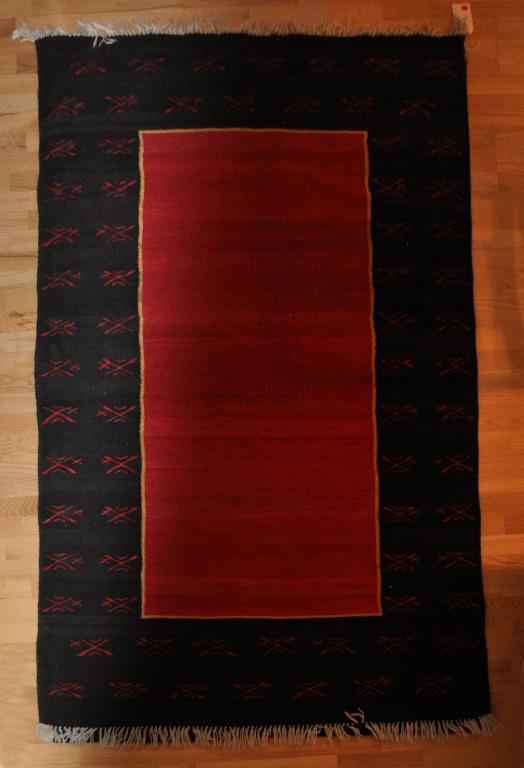 Southwest Themed Woven Area Rug: in geometric design. 4' 3" wide, 7' long. All rugs sold as is.