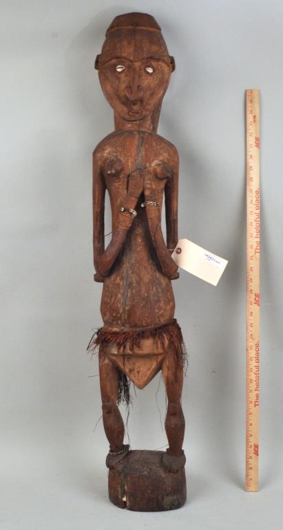 African Carved Standing Female Figure: 41 1/2" high, 8" wide. Age cracks, losses to skirt. Provenance: Estate of Lucy Jarvis, NYC.