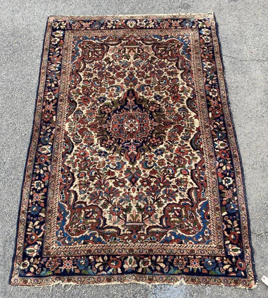 Persian Area Rug: 4' 10" by 7' 1". All rugs sold as is.