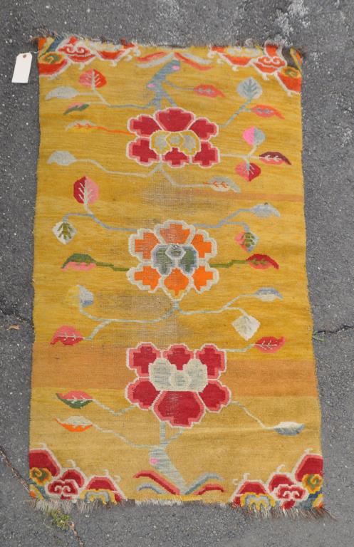 Chinese Yellow Ground Rug with Blossoms: 5' 8" by 3' 2". Wear to middle, slight fading. All rugs sold "as is." Provenance: Estate of Lucy Jarvis, NYC.