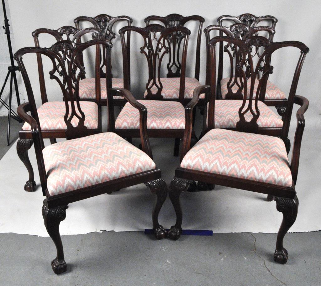 Set Eight Chippendale Mahogany Dining Chairs: six side and two arm chairs, with elaborate carved back splats and carved cabriole legs with claw and ball feet, slip seats. England, 19th century. Side chair: 39" high, 22" wide, 21" deep, Arm chair: