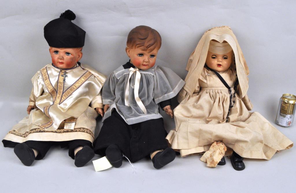 3 Large Religious Dolls: Priest, Nun, & Altar Boy: the priest and altar boy with rubber heads, hands and feet, the nun with composition head. Largest: 26 1/4" high, 13 1/2" wide. Soiling, nun with extensive deterioration, losses to hands and feet. Pro