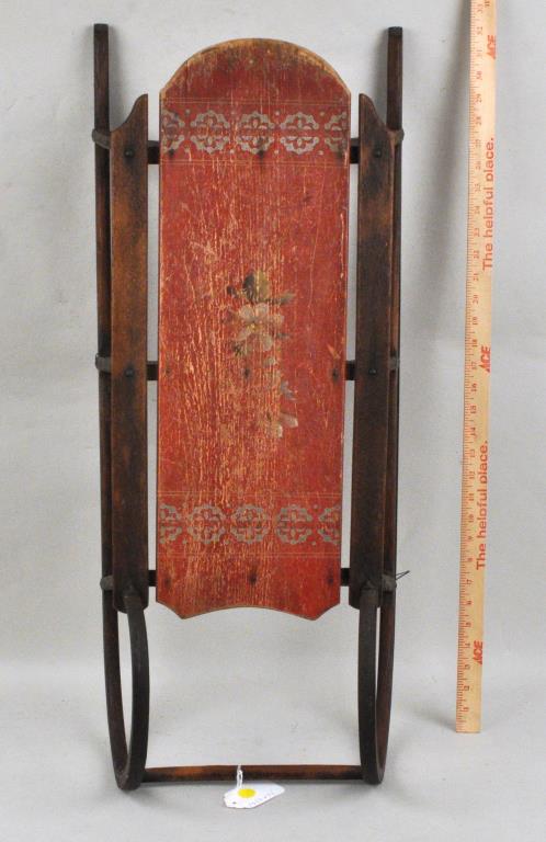 Antique American Child's Red Painted Sled: with floral decoration. 33 1/2" long, 14" wide. Use wear, paint wear, loss, rust.