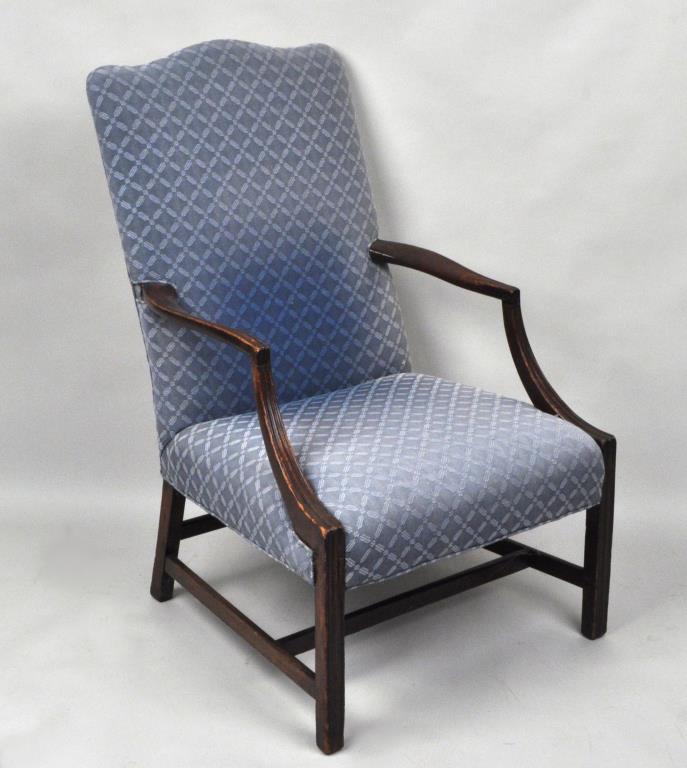 Hepplewhite Mahogany Lolling Chair: with shaped crest, beaded serpentine arms and tapering legs with stretcher base. 19th century. 42" high, 25 1/2" wide, 23 1/4" deep. Substantial wear, loose joints, worn upholstery. Provenance: Proper