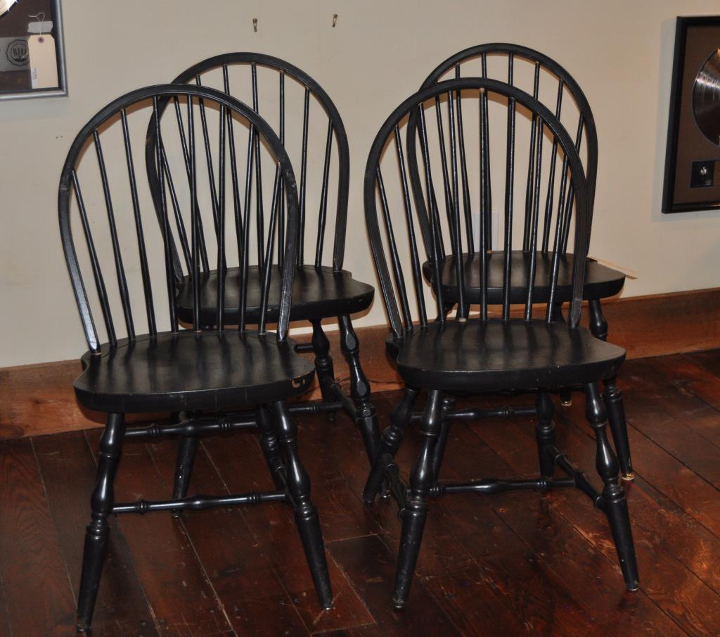Set Four Black Painted Windsor Side Chairs: bow back style in black paint with turned legs and stretchers, 20th century. 36 1/2" high, 19" wide, 16" deep. Use wear, paint wear, loss, scuffs, old scratches, marring to seats, some loose spindles.
