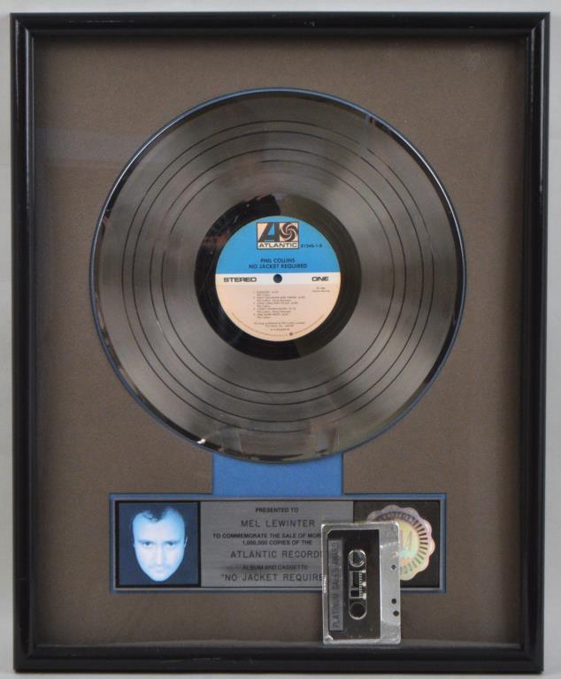 Phil Collins RIAA Platinum Sales Award: presented for "No Jacket Required" album and cassette. Not examined out of frame. 21" high, 17" wide. Cassette detached within frame. Provenance: Shagbark Farm, Party Barn, Washington CT.