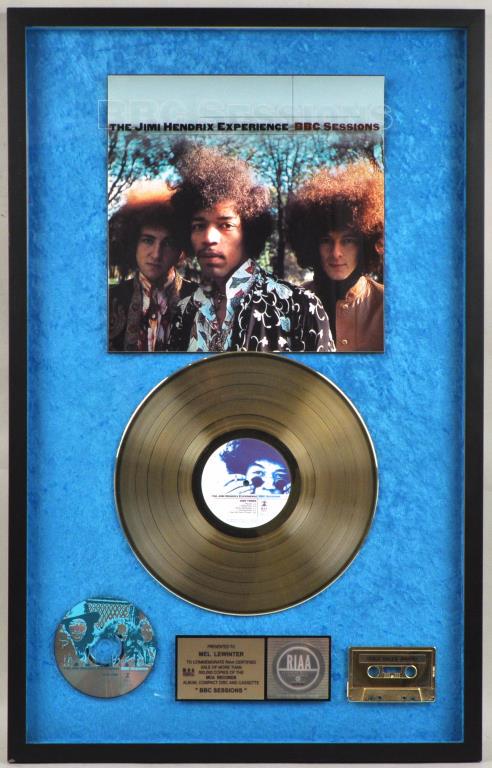 Jimi Hendrix Experience RIAA Gold sales Award: large shadowbox format presented for "BBC Sessions" album, cassette, and cd. 33 1/2" high, 21 1/4" wide. Cover artwork lifting at top edge within frame. Not examined out of frame. Provenance: Shagbark
