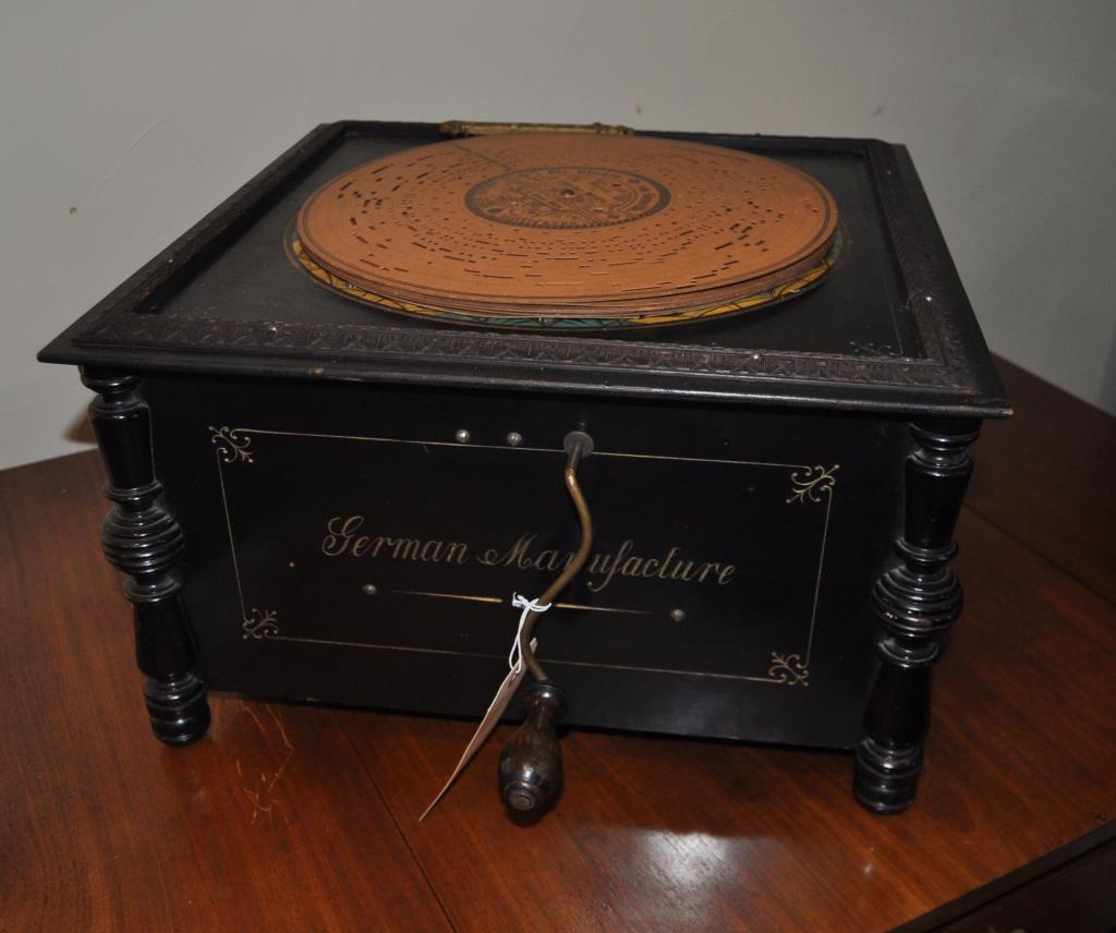Vintage German Ariston Organette Music Player: early 20th century hand crank music box with six cardboard discs. 11" high, 18 1/4" wide, 18 1/4" deep. In working condition but needs adjustments. Provenance: Shagbark Farm, Party Barn, Washington CT