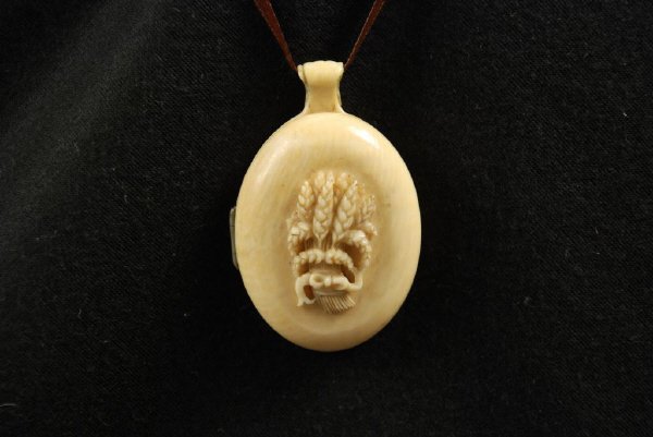 Victorian Carved Ivory Locket: Victorian carved ivory locket with carved wheat design, circa 1850. 2 1/4" long, 1 1/2" wide.