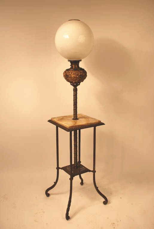 Victorian Bradley and Hubbard Piano Lamp: Victorian Bradley and Hubbard piano lamp. Original white globe upon a legged brass base with a marble top, 61" high, 14" wide. Together with a Victorian Juno oil lamp of brass metal and marble which s